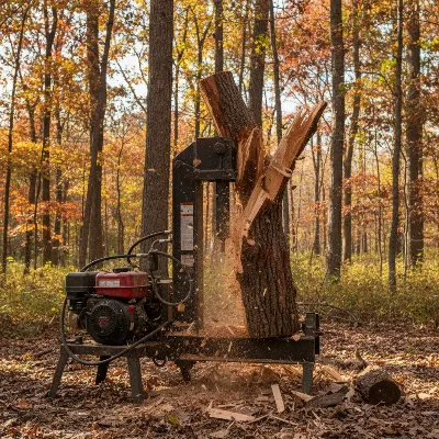 Dirty Hand Tools 22 Ton Gas Log Splitter splitting a large, knotty hardwood log in a rustic outdoor setting